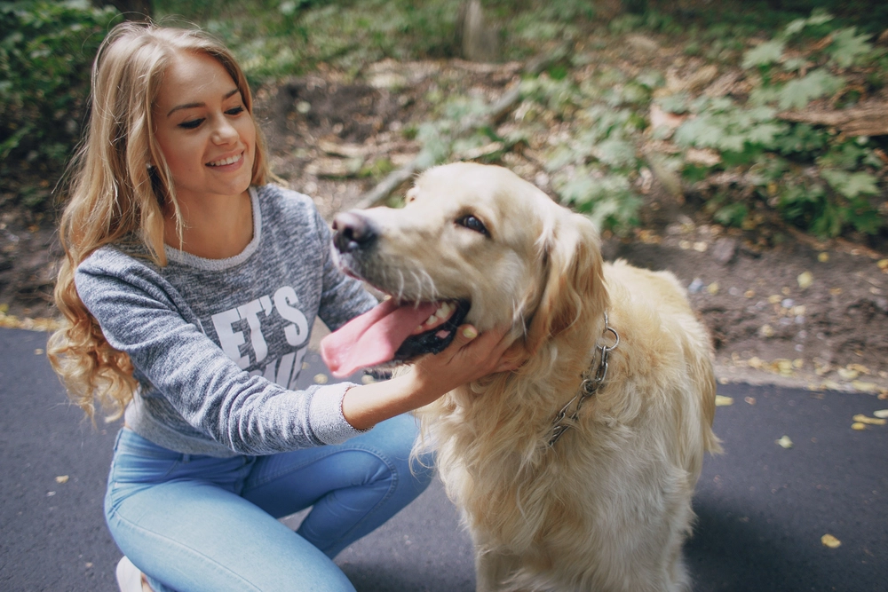 Girl with golden retriever