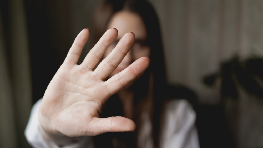 Stop, woman using hand to sign stop