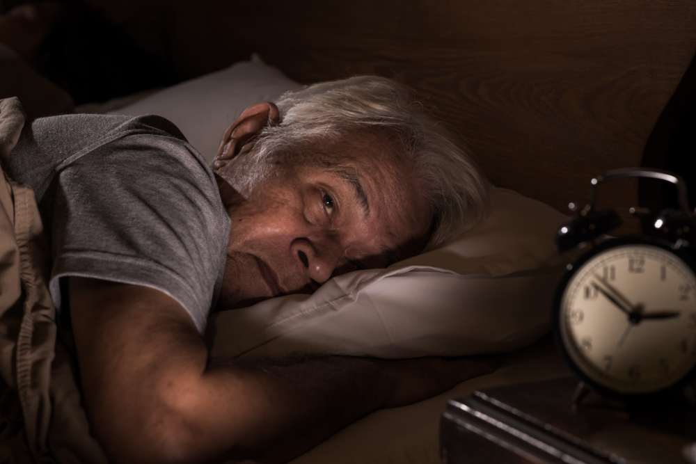 Elderly man having trouble sleeping