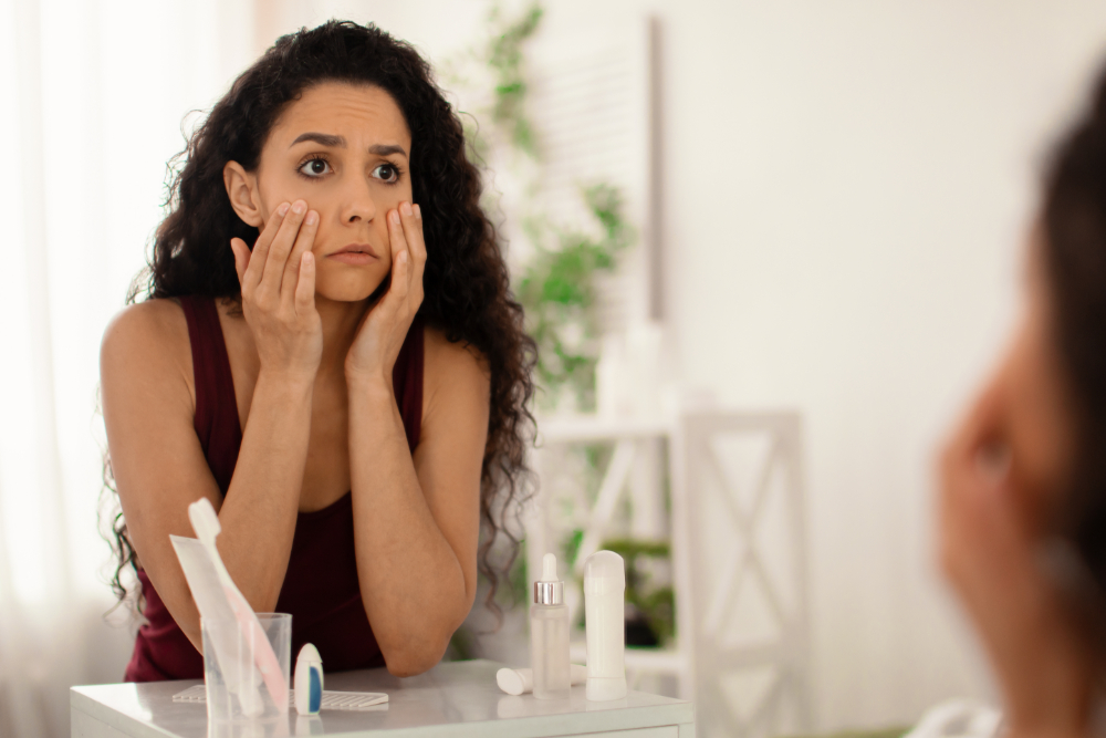 Woman looking in mirror