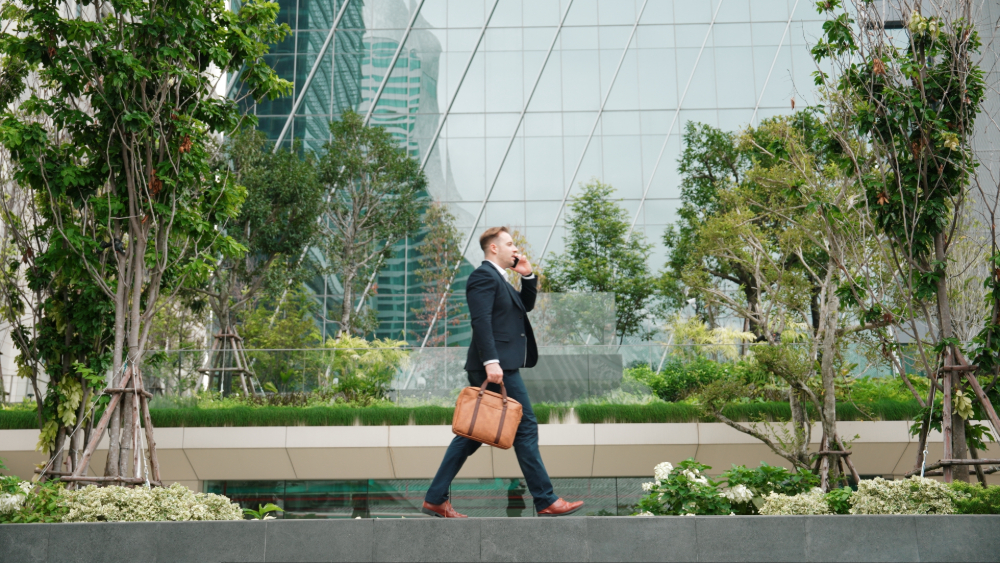 Male talking in phone while walking