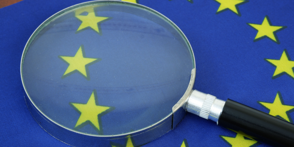 EU, magnifying glass