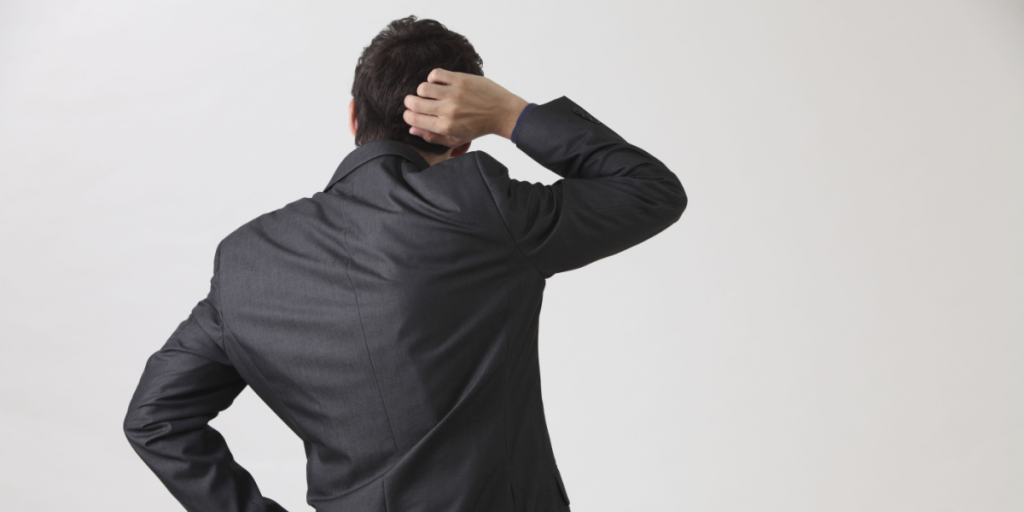 Scratching head, suit