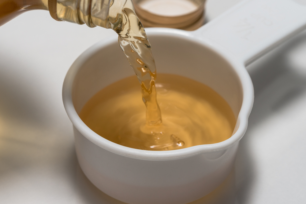 Pouring,Apple,Cider,Vinegar,Measuring,Cup