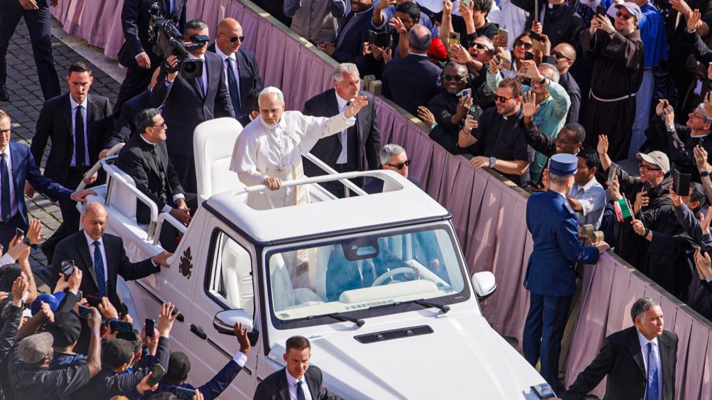 Pope Leo XIV in the popemobile being all popy and stuff