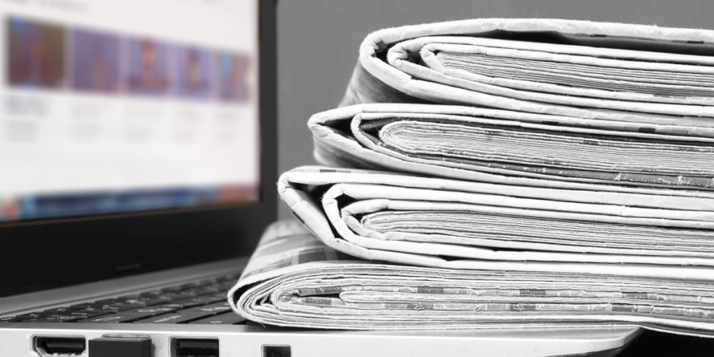 Laptop, news papers