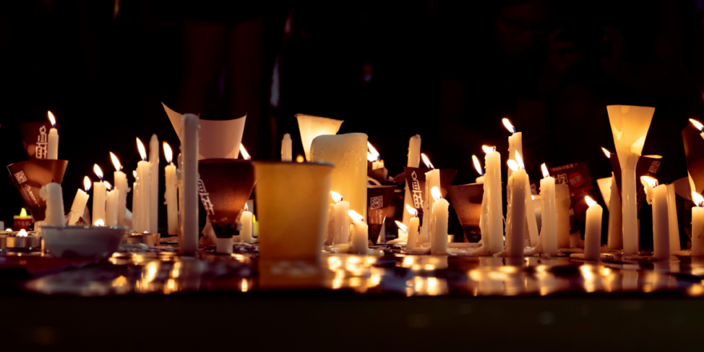 HONG KONG, JUNE 4 2020: Defying the gathering ban, thousands of protesters come to Victoria Park for the Tiananmen Incident vigil, lighting numerous candles in memory of those losing lives.
