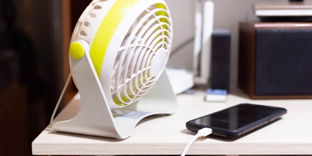 Phone, fan, desk