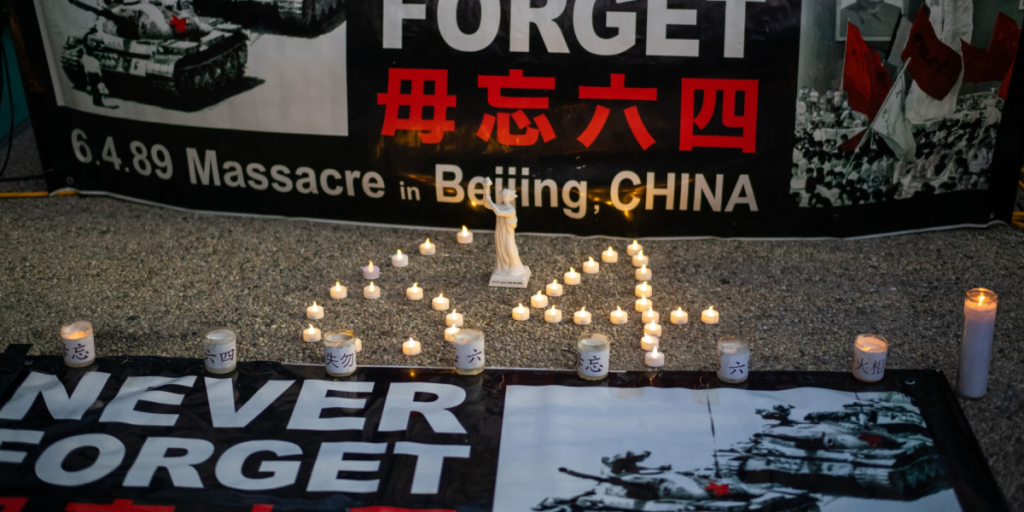 Participants attend a candlelight vigil outside the Chinese consulate general in Los Angeles on Tuesday, June 4, 2024, to mark the 35th anniversary of the Tiananmen Square massacre.