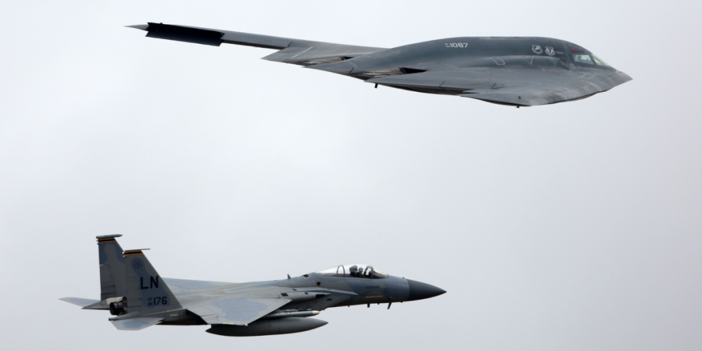 Northrop B-2A Spirit of US air force in formation during demo flight at Royal International Air Tattoo show at Fairford AFB