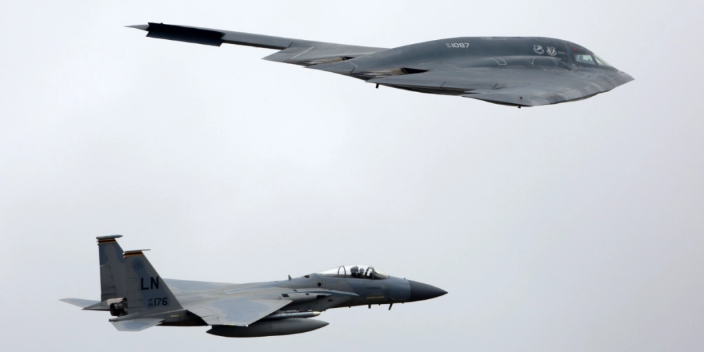 Northrop B-2A Spirit of US air force in formation during demo flight at Royal International Air Tattoo show at Fairford AFB