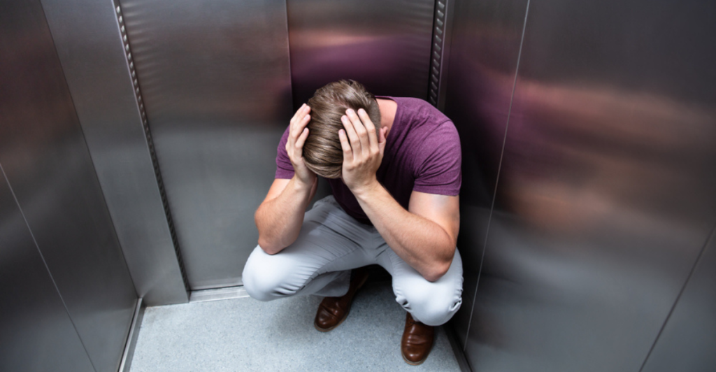elevator,man,stressed