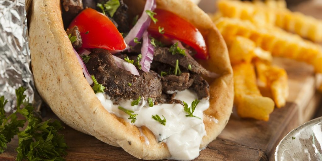 Homemade,Meat,Gyro,With,Tzatziki,Sauce,,Tomatos,And,French,Fries