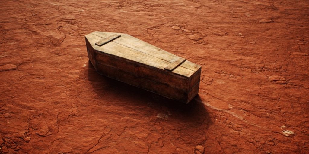 Old,Wooden,Coffin,On,Rocky,Terrain,In,Desolate,Desert.