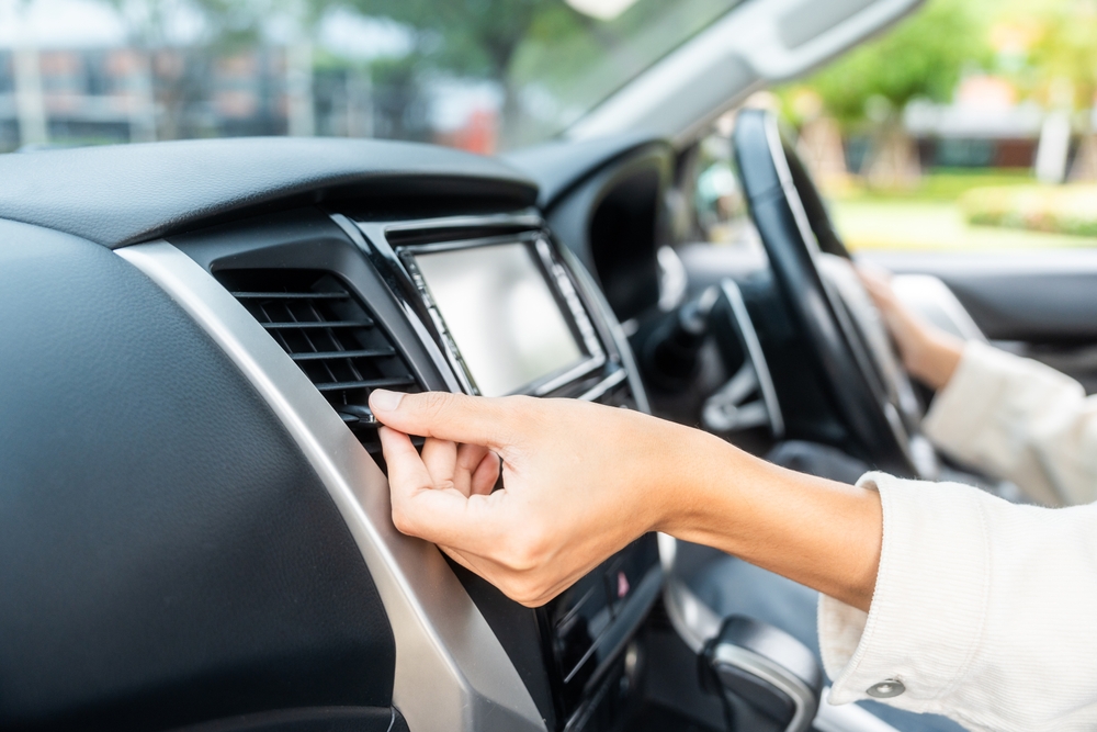 Female,Hand,Checking,Air,Conditioning,Panel,Inside,Car.