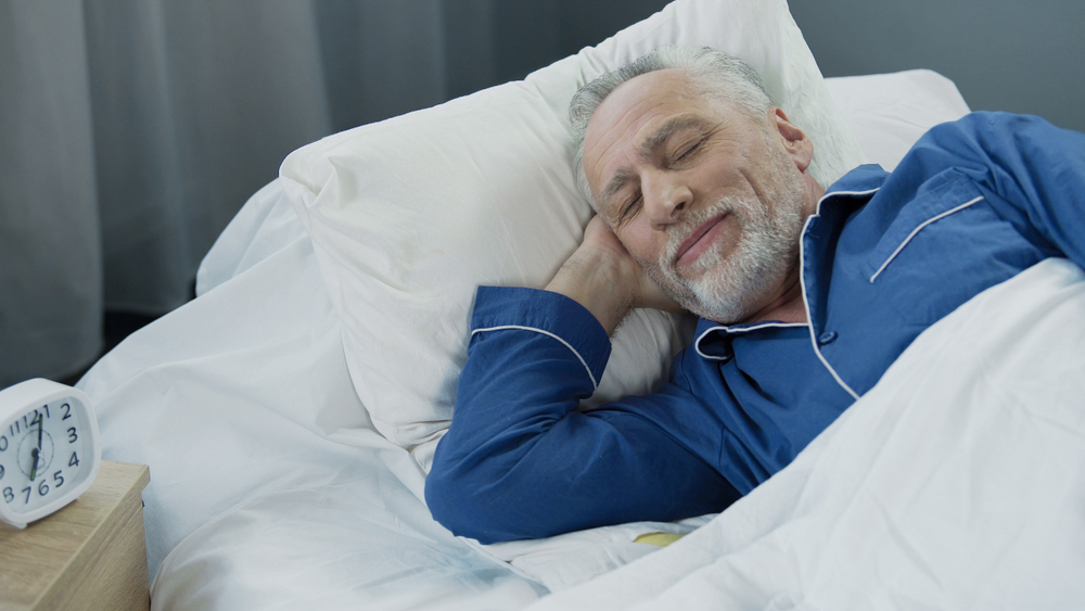 Senior,Man,Smiling,While,Asleep,In,The,Morning,,Pleased,Pensioner