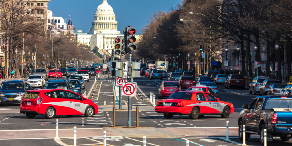 Pennsylvania Ave to US Capitol going towards US Capitol in Washington DC. during rush hour PM features Red Taxis