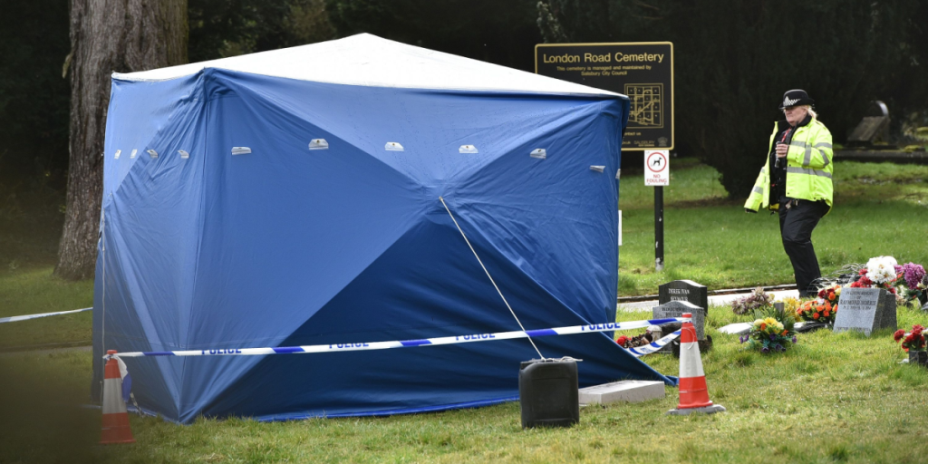 Police attend a crime scene at a cemetery. Police were investigating the poisoning of former Russian spy Sergei Skripal.