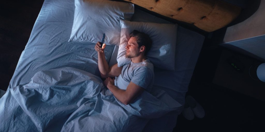 man bed alone lonely phone sleep sleepless