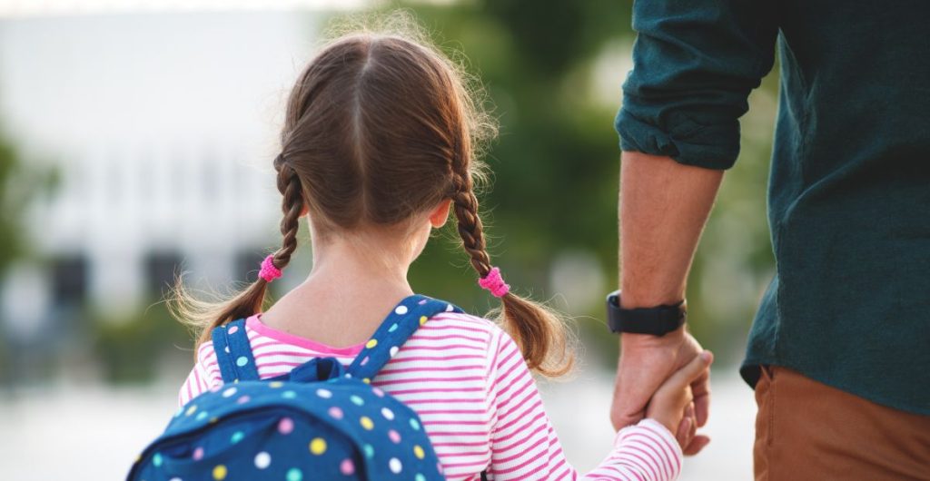 pige girl holding hands dad