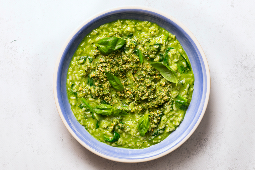 Green,Risotto,With,Spinach,And,Basil,Pesto.,Blue,Plate,On