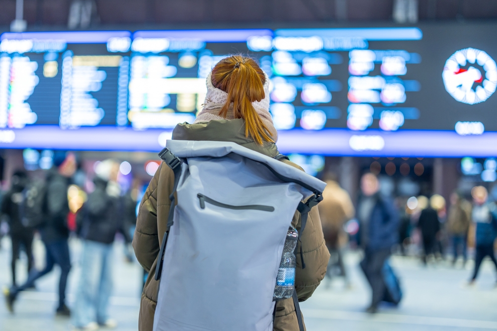Back,View,Of,An,Unknown,Woman,In,Orange,Hair,Standin