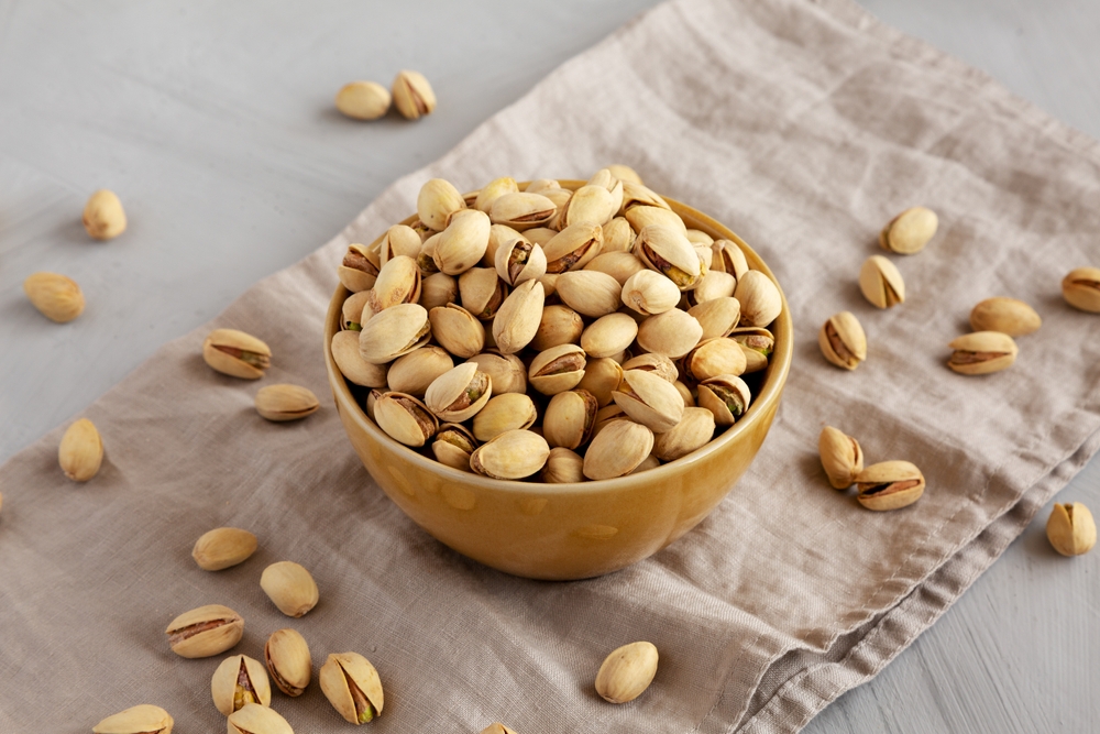 Roasted,And,Salted,Pistachios,In,A,Bowl,On,A,Gray