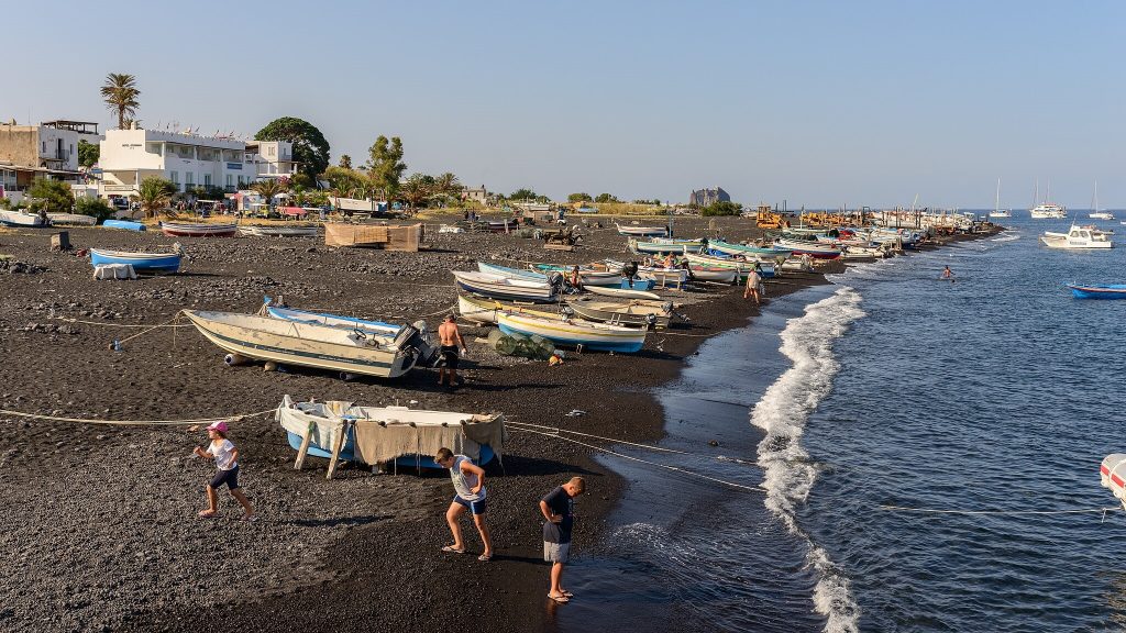Beach with fishing boats italy