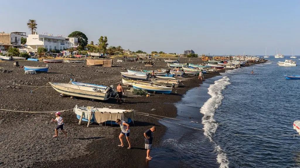 Beach with fishing boats italy