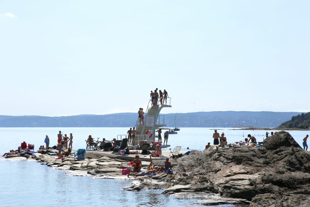 Norway, Beach in Oslo Fjord, Ulvøya, sunbathing,swimming, jumping, summer, sommer, stupetårn, svaberg, bade, bading