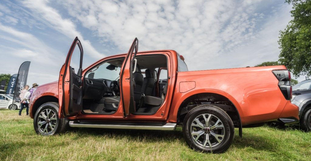 Orange Isuzu D-Max pickup truck