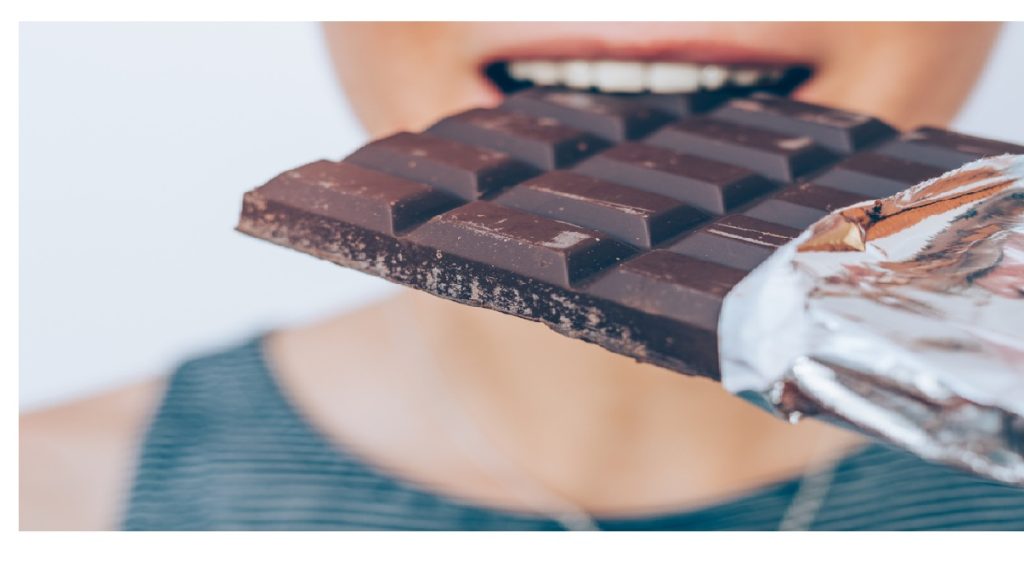 dark chocolate woman eating
