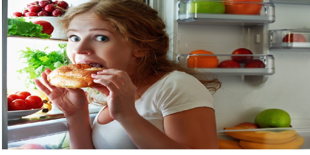 eating snack night fridge