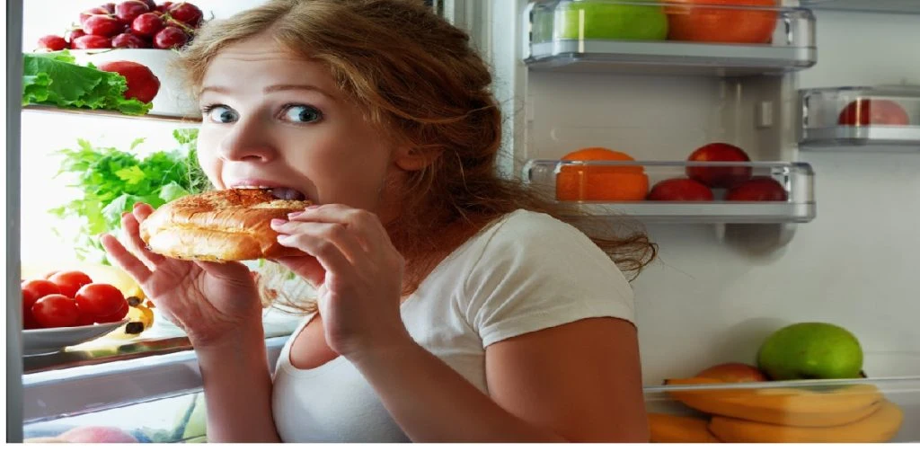 eating snack night fridge