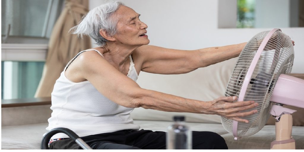 senior woman cooling wind