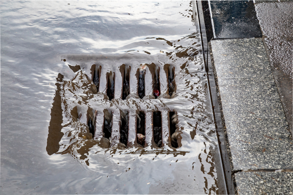 Rain,Flowing,Into,A,Storm,Water,Sewer,System.,Stormwater,Street