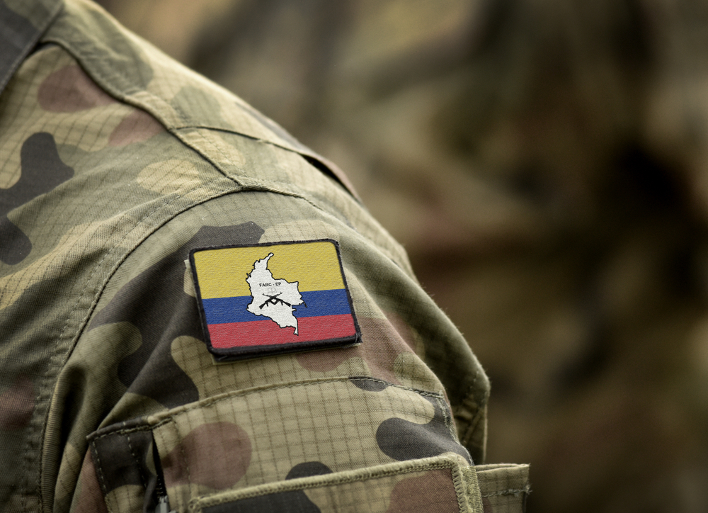 Flag of Revolutionary Armed Forces of Colombia (FARC) on military uniform. Revolutionary Armed Forces of Colombia — People's Army