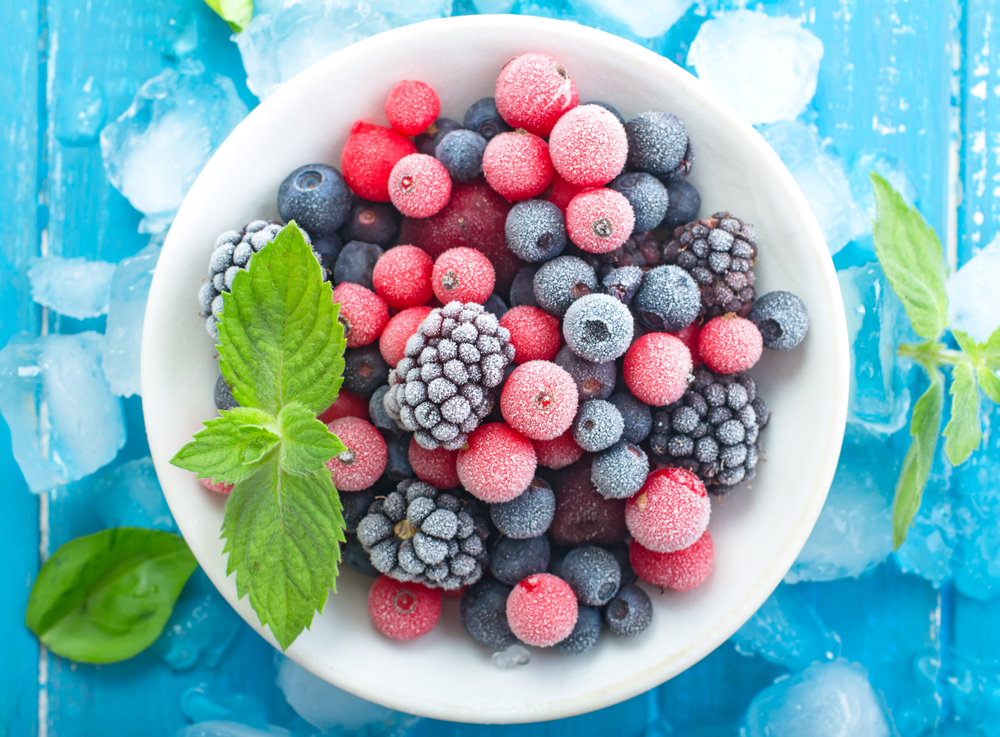 Frozen,Berry,On,Turquoise,Background,Top,View