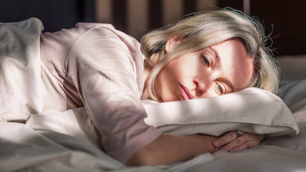 Close,Up,Top,View,Middle-aged,Woman,Lying,Down,In,Bed