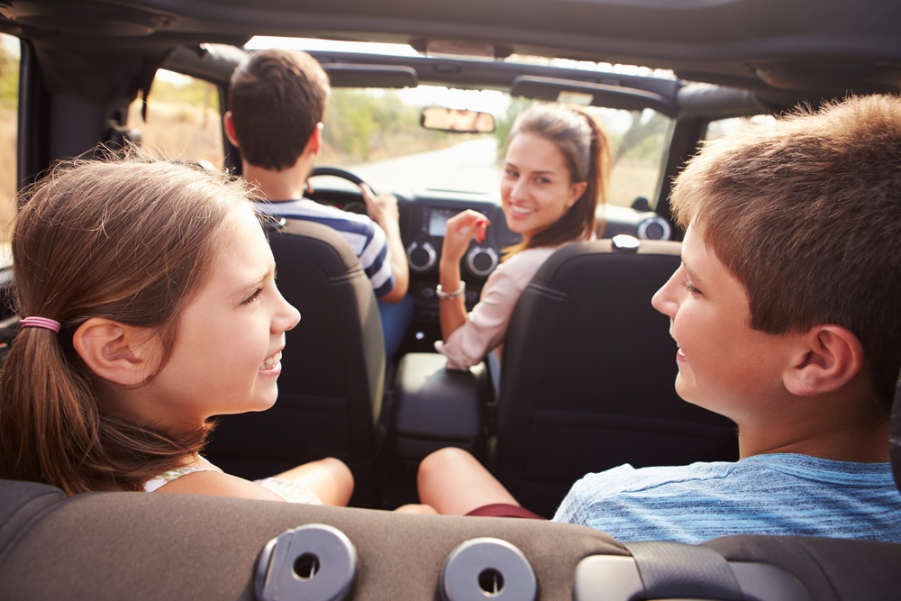 Parents,Taking,Children,On,Trip,In,Open,Top,Car