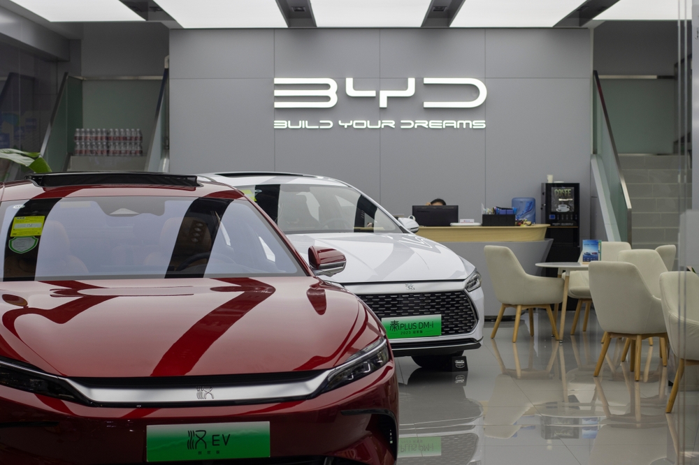 Qin Plus DM-i plug-in hybrid sedan and Han all-electric sedan are displayed in a BYD store in Beijing
