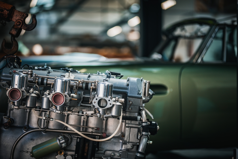 Newly restored engine for a classic car in a background stored in a restauration garage, veteranbil