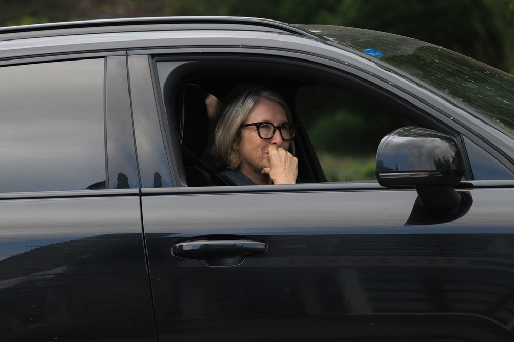 A,Female,Driver,Looking,Out,Of,A,Car,Window