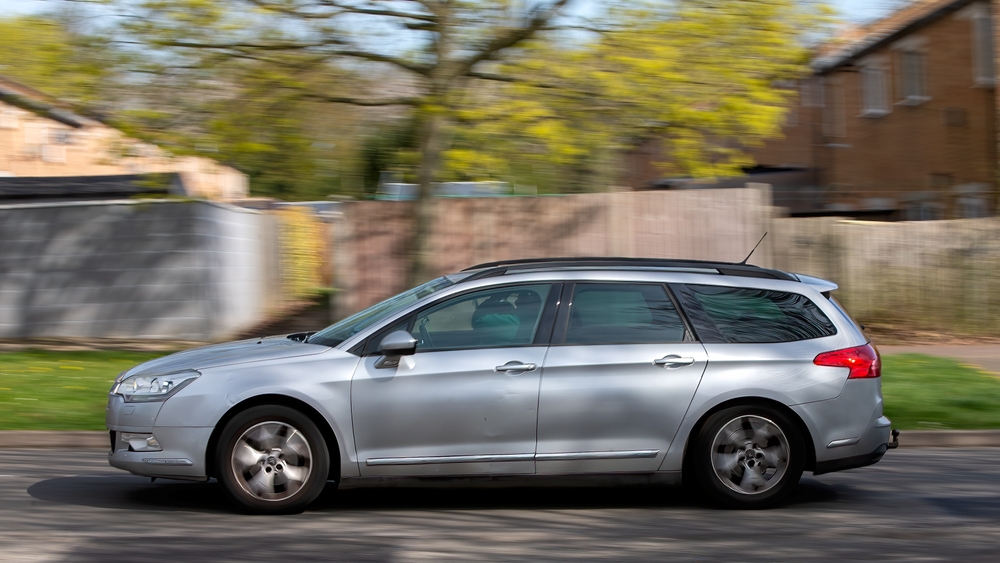 2010 Citroen C5 diesel engine estate car driving on British road, bil, auto