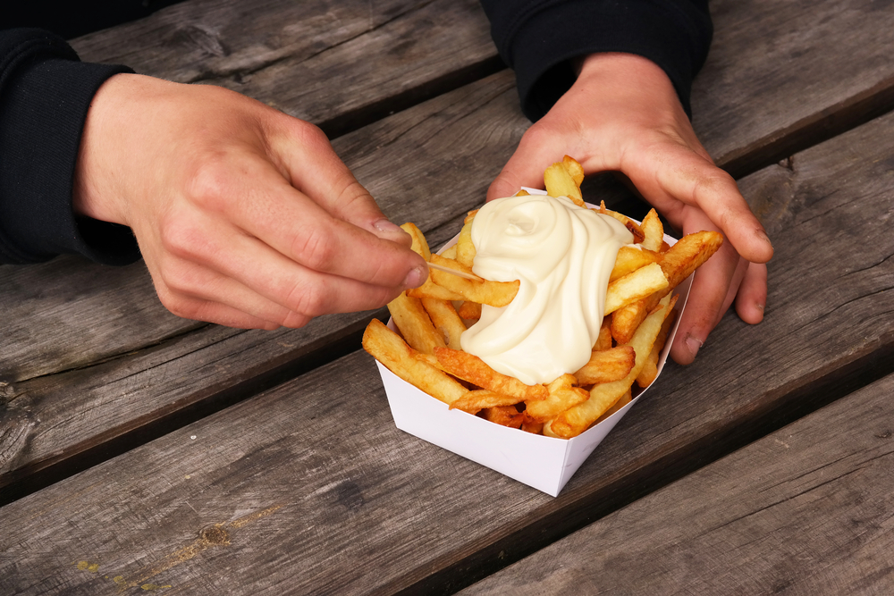 Belgian,Pommes,Frites.,Hands,With,A,Tray,Of,Belgian,Fries