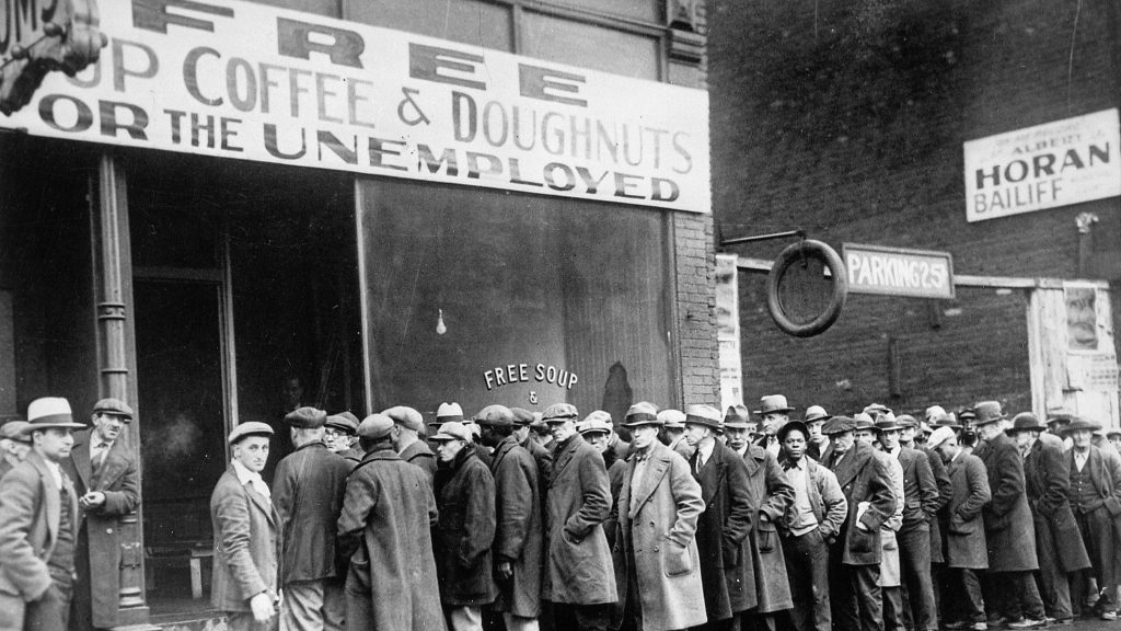 Unemployed men queued outside a depression soup kitchen opened in Chicago by Al Capone