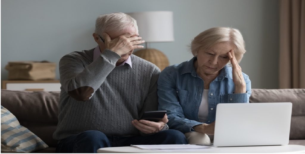 couple laptop unhappy