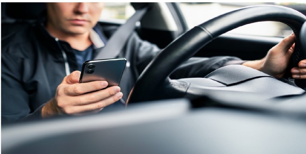 man driving phone