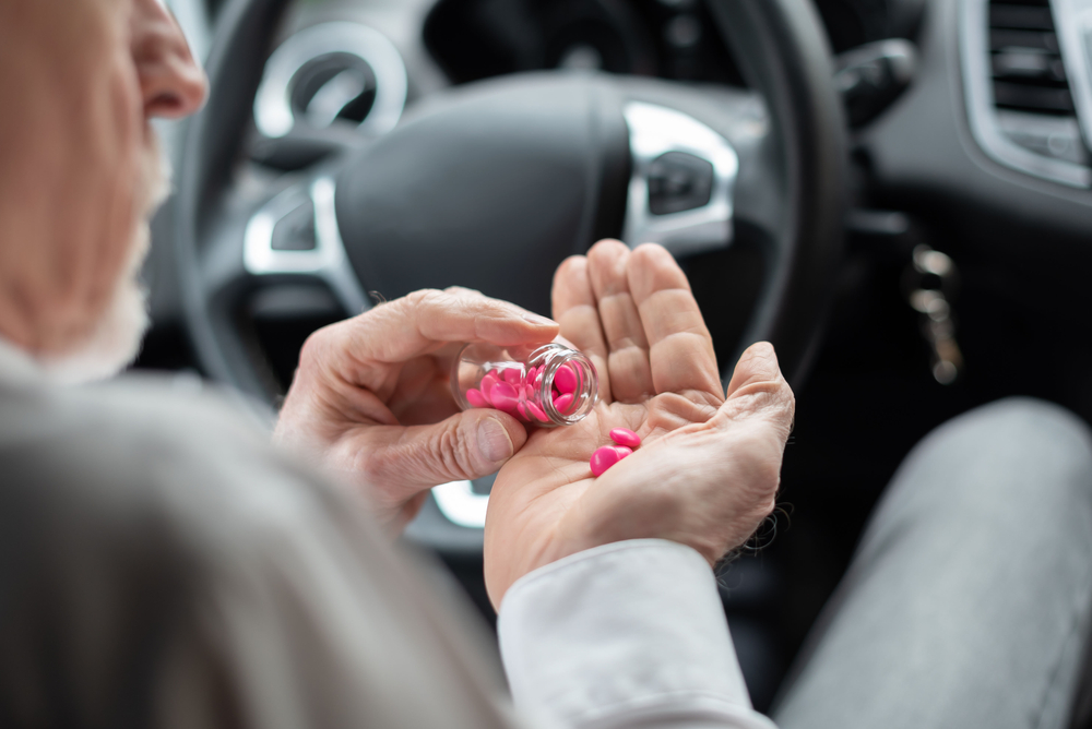 Man,Sitting,In,Car,And,Taking,Pills,Before,Driving,Medicin,Bil