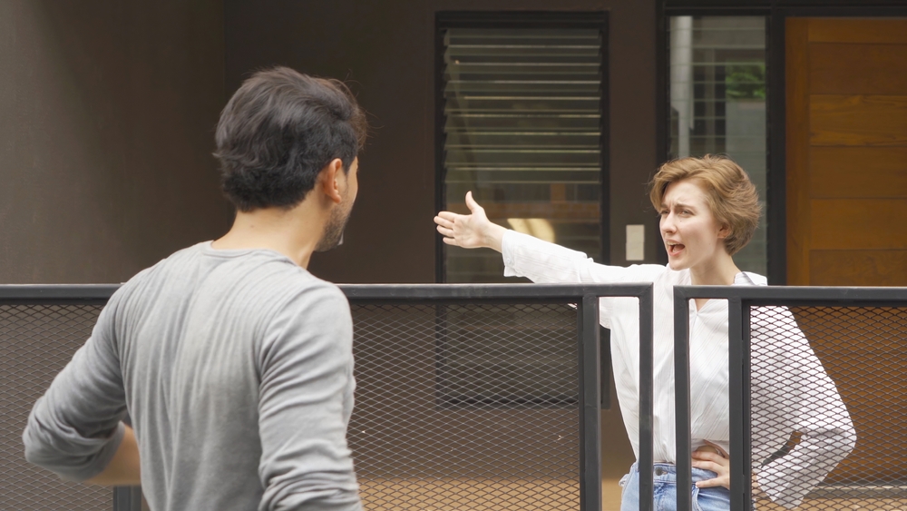 An,Angry,Neighbor,Shouting,,Blaming,,Yelling,At,Each,Other,In